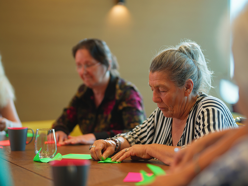 A group of people in a craft session 