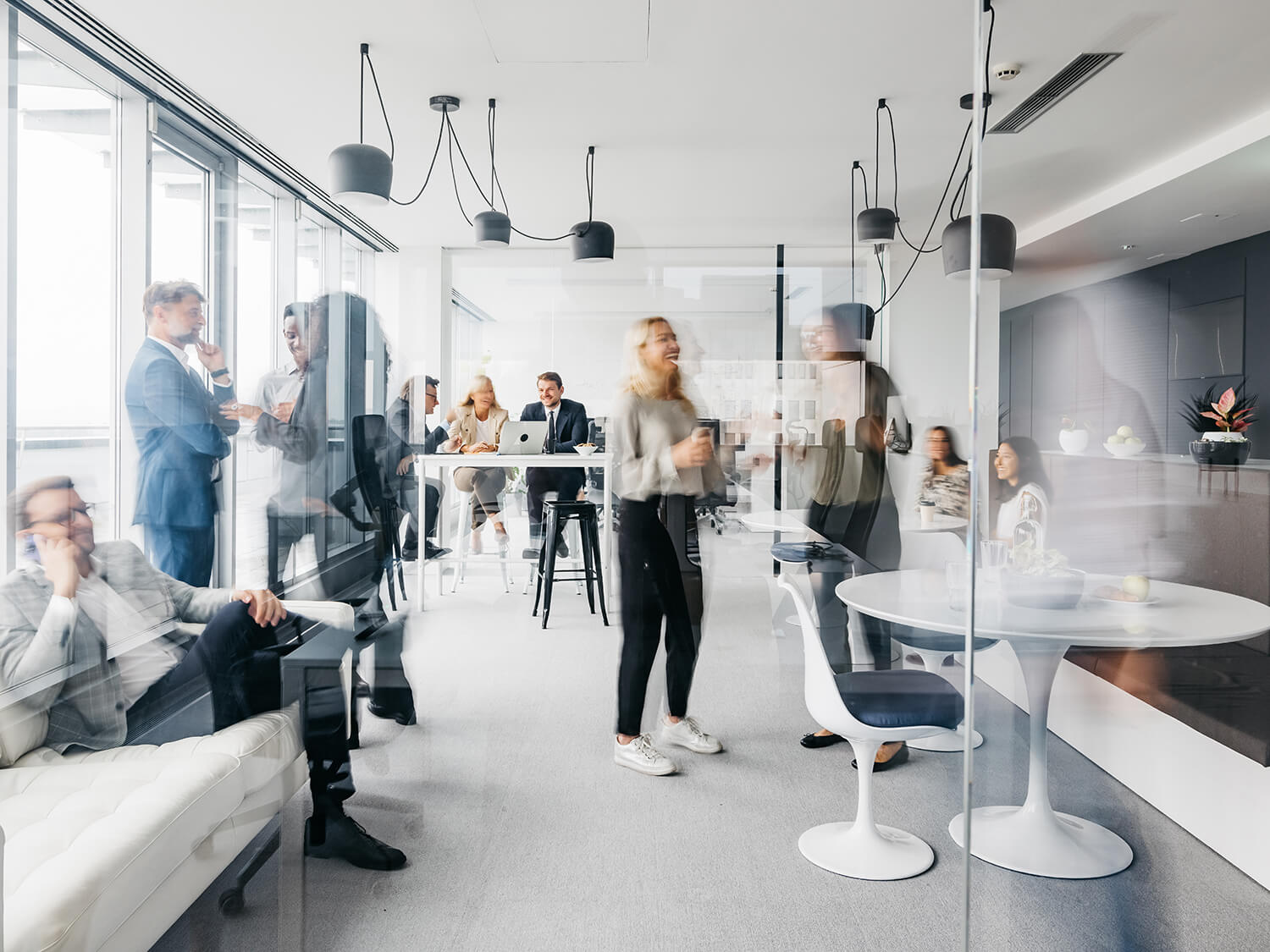A modern image showing employees in an office location showing the sense of movement 