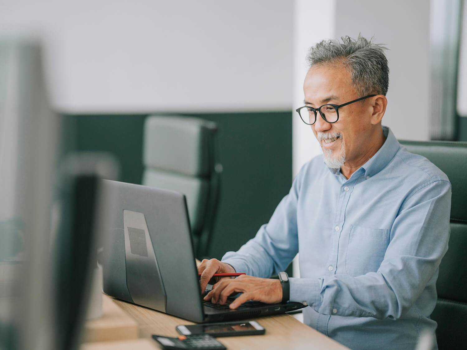 A professional man at work on his laptop 