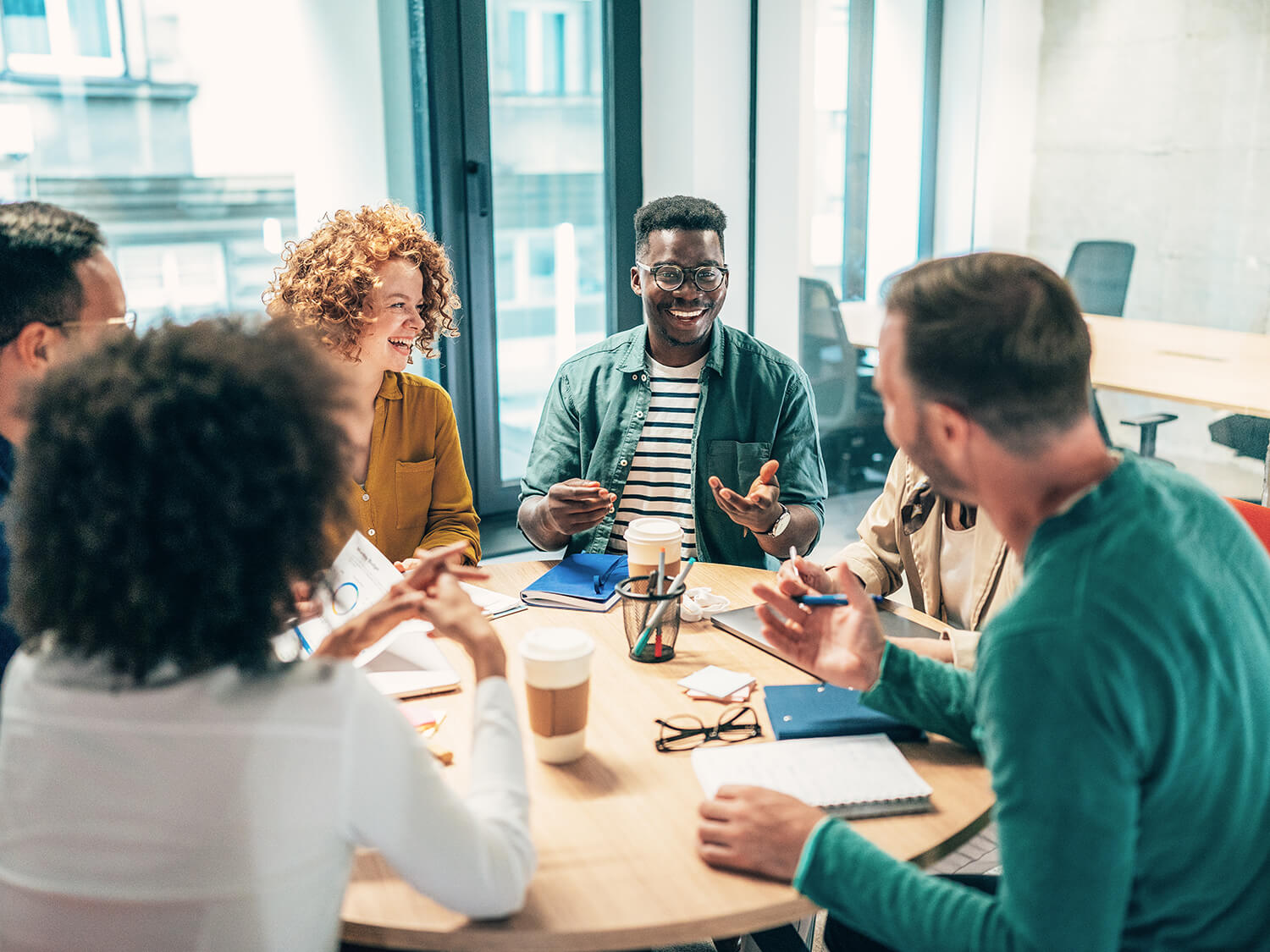 A group of work colleagues at an informal business meeting 