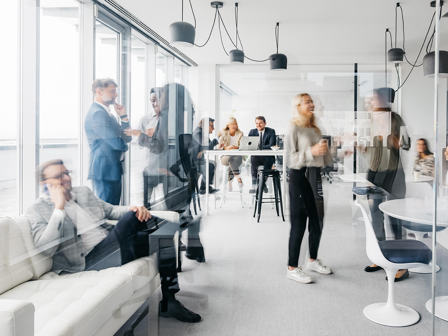 A modern image of people in the office showing movement 